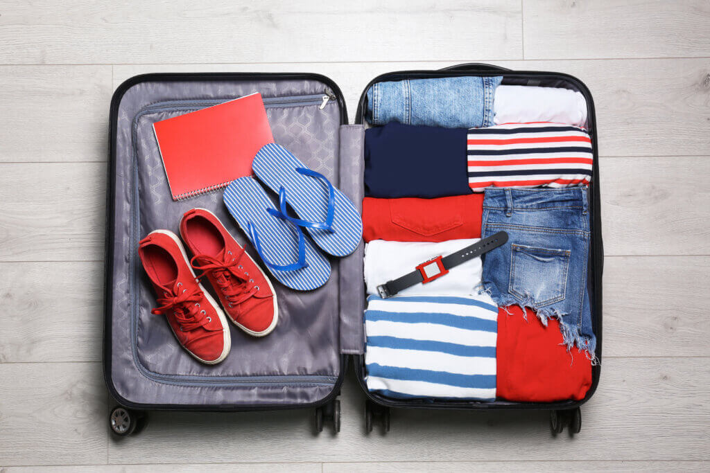 Packing suitcase for vacation photo